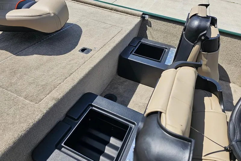 Slide: The Image of 2026 Tracker Bass Tracker Classic Limited boat interior with beige seats and storage compartments. - 8