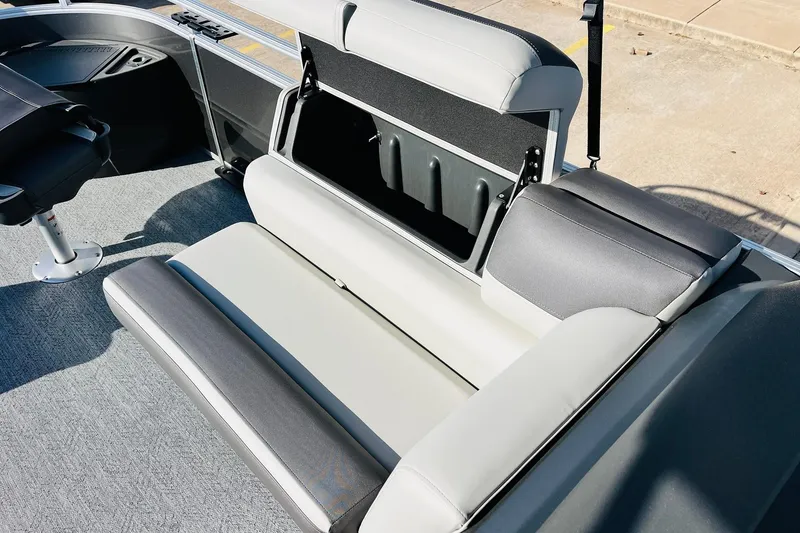 Slide: The Image of 2026 Sun Tracker Fishin' Barge 22 DLX boat seat with storage compartment open. - 20