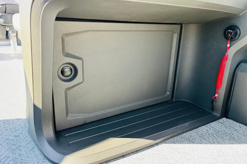 Slide: The Image of Storage compartment in 2026 Sun Tracker Fishin' Barge 22 DLX boat interior. - 34