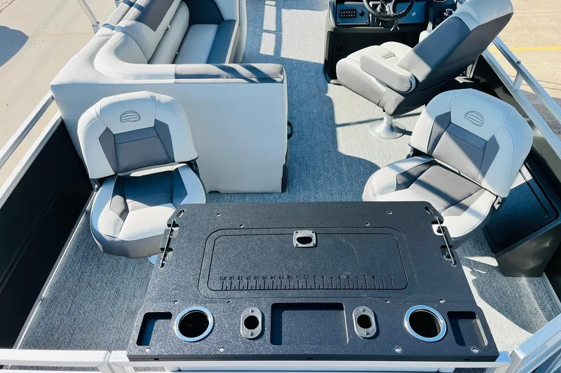 Slide: The Image of 2026 Sun Tracker Fishin' Barge 22 DLX interior with seating and fishing station. - 41