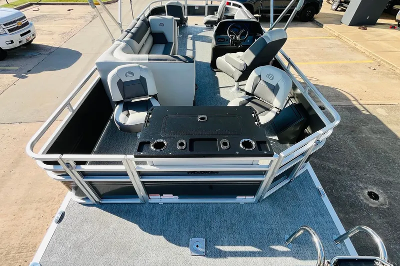 Slide: The Image of 2026 Sun Tracker Fishin' Barge 22 DLX pontoon boat with spacious seating and fishing amenities. - 9