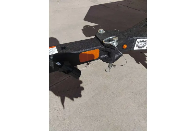 Slide: The Image of Trailer hitch of 2026 Tracker Pro 170 boat on concrete surface. - 5