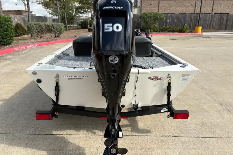 Slide: The Image of 2026 Tracker Pro 170 boat with Mercury 50 engine, parked on concrete surface. - 11