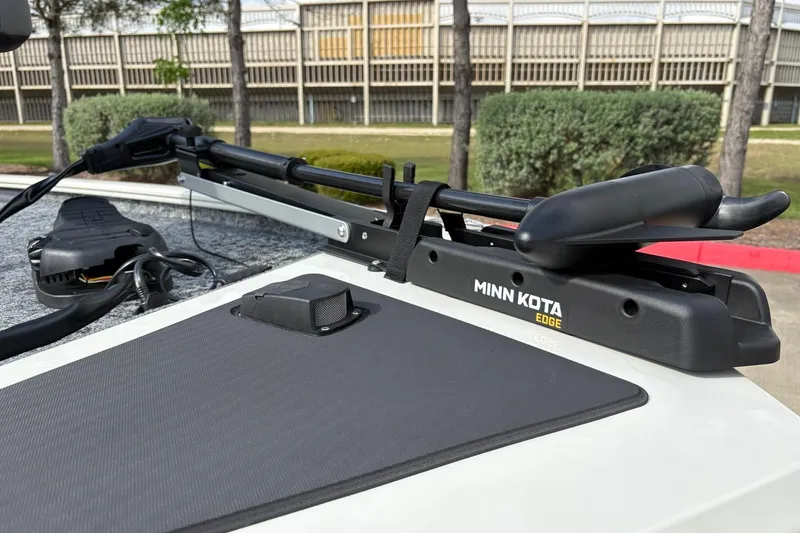 Slide: The Image of 2026 Tracker Pro 170 with Minn Kota Edge trolling motor, parked outdoors. - 8