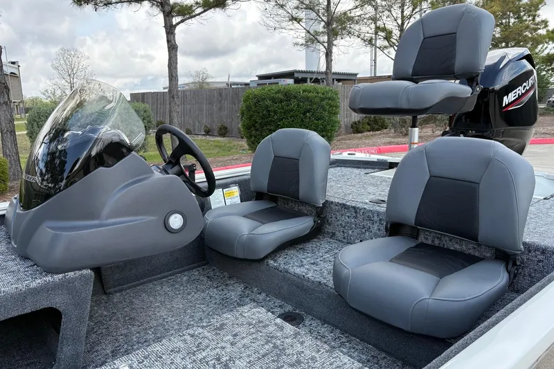 Slide: The Image of 2026 Tracker Pro 170 boat interior with gray seating and Mercury engine. - 10