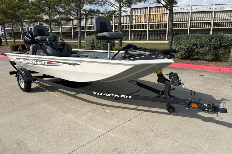Slide: The Image of 2026 Tracker Pro 170 boat on trailer, parked outdoors, showcasing sleek design. - 6