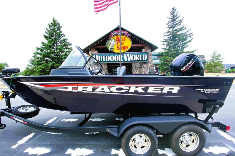 The Image of 2026 Tracker Pro Guide V-175 WT boat on trailer outside Bass Pro Shops. - 0
