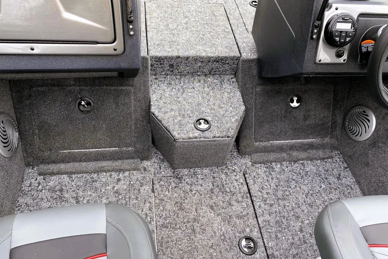 Slide: The Image of Interior of 2026 Tracker Pro Guide V-175 WT boat, featuring carpeted flooring and control panel. - 10