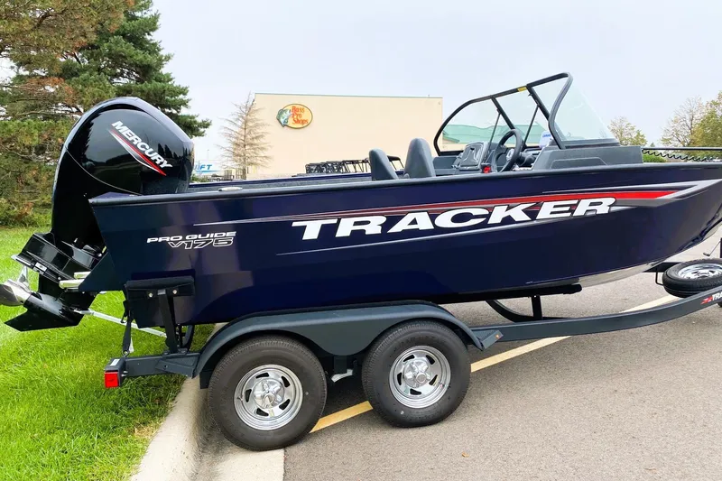 Slide: The Image of 2026 Tracker Pro Guide V-175 WT boat on trailer, featuring Mercury outboard motor. - 11