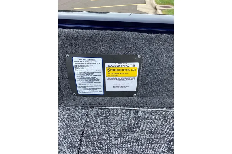 Slide: The Image of 2026 Tracker Pro Guide V-175 WT capacity label, maximum 6 persons or 838 lbs. - 13