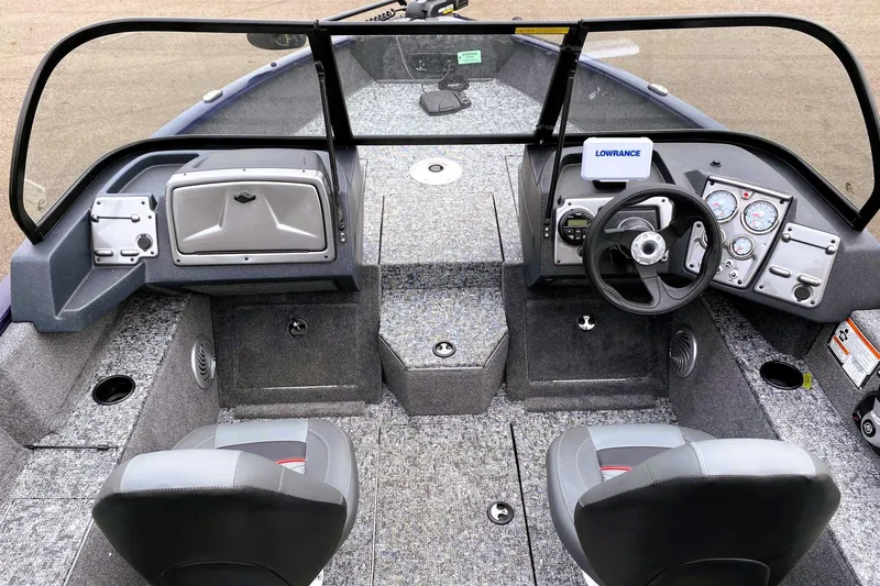 Slide: The Image of Interior view of 2026 Tracker Pro Guide V-175 WT boat with steering console and seating. - 4