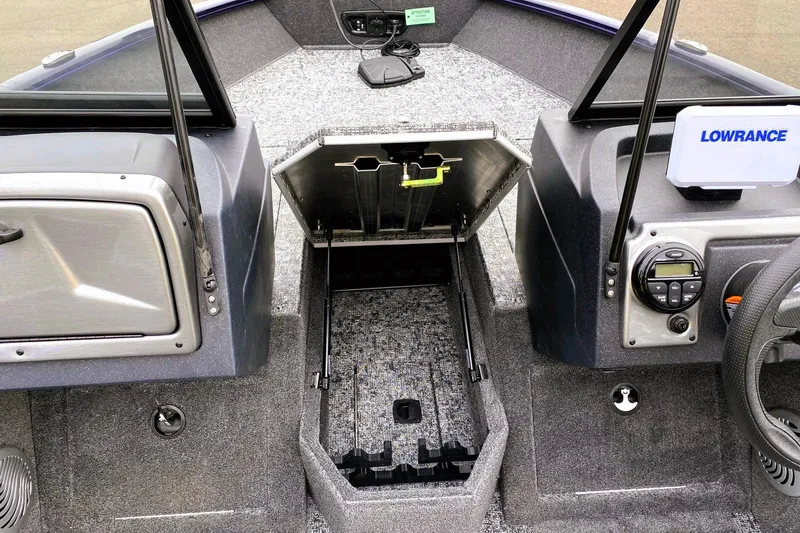 Slide: The Image of 2026 Tracker Pro Guide V-175 WT boat interior with storage compartment and Lowrance electronics. - 5