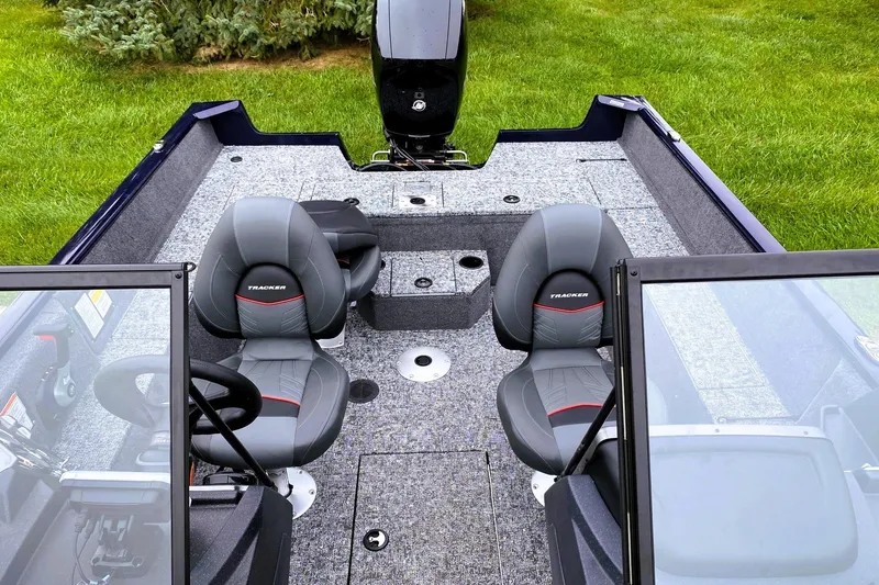 Slide: The Image of 2026 Tracker Pro Guide V-175 WT boat interior with dual seats and steering wheel. - 8
