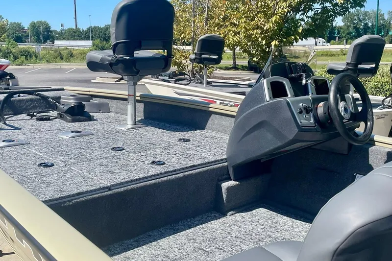 Slide: The Image of 2026 Tracker Pro Team 175 Crappie Edition boat interior with steering console and seating. - 3