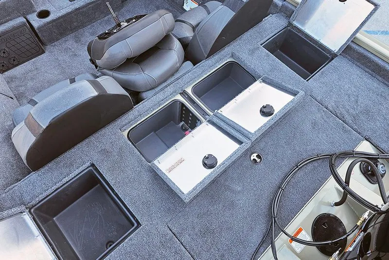 Slide: The Image of 2026 Tracker Pro Team 195 boat interior with storage compartments and seating. - 12