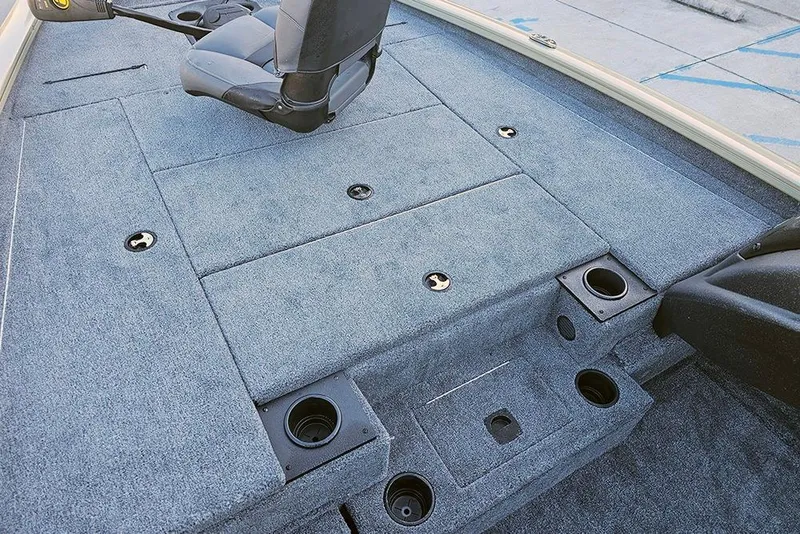 Slide: The Image of 2026 Tracker Pro Team 195 boat interior with carpeted deck and swivel seat. - 15