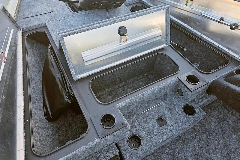 Slide: The Image of 2026 Tracker Pro Team 195 boat interior with storage compartments and cup holders. - 17