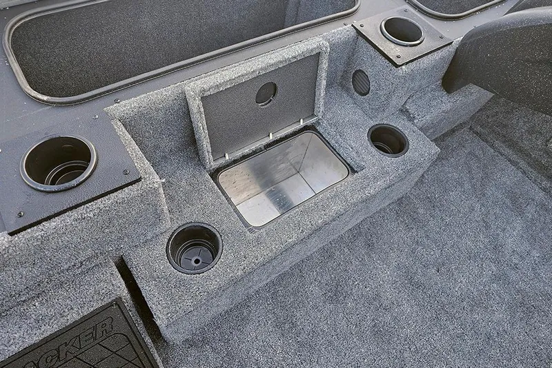 Slide: The Image of Interior of 2026 Tracker Pro Team 195 boat with storage compartments and cup holders. - 18