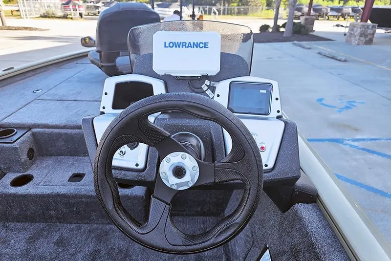 Slide: The Image of 2026 Tracker Pro Team 195 boat dashboard with steering wheel and Lowrance electronics. - 9