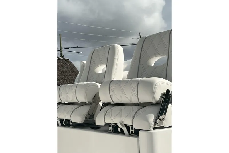 Slide: The Image of 2024 Contender 32 ST boat seats with white upholstery and elegant stitching. - 8