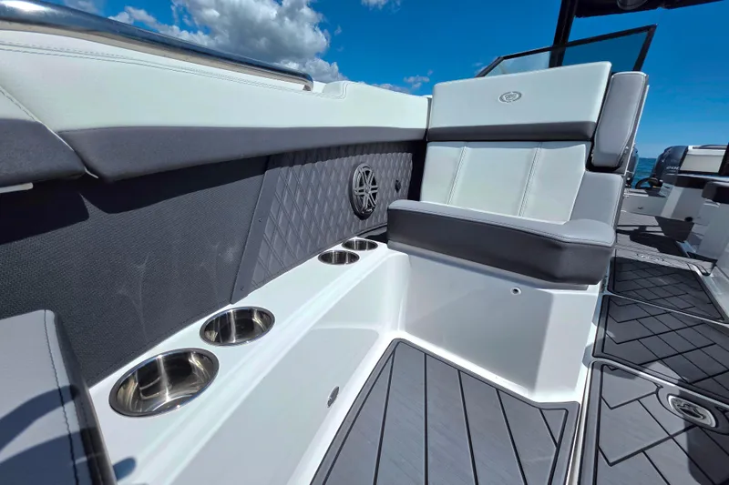 Slide: The Image of 2024 Cobalt R8 Outboard boat interior with cushioned seating and cup holders. - 18