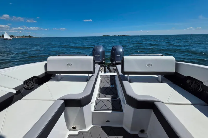 Slide: The Image of 2024 Cobalt R8 Outboard boat with dual engines on open water. - 20