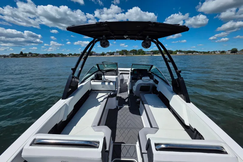 Slide: The Image of 2024 Cobalt R8 Outboard boat interior on a sunny day, featuring sleek seating and modern design. - 21