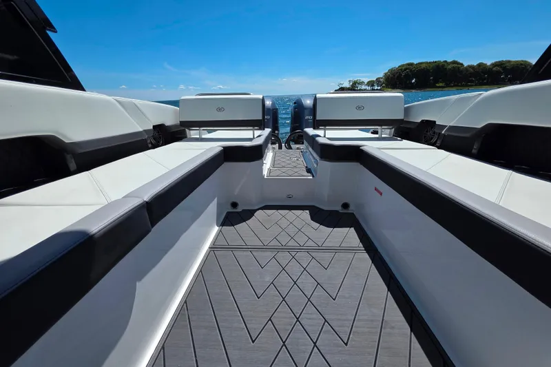 Slide: The Image of 2024 Cobalt R8 Outboard boat interior with sleek seating and scenic water view. - 27