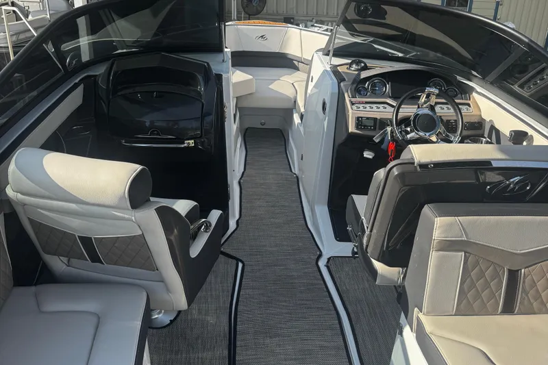 Slide: The Image of 2021 Monterey 255SS Super Sport boat interior with luxurious seating and modern dashboard. - 17