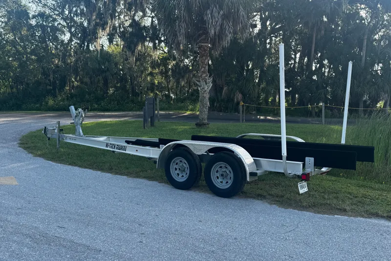 Slide: The Image of Trailer for 2021 Monterey 255SS Super Sport boat parked on roadside. - 31