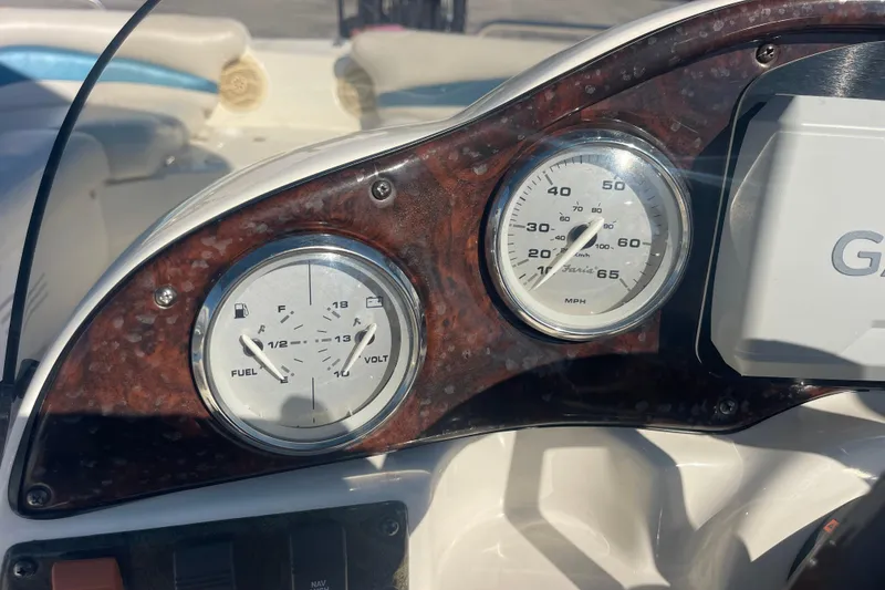 Slide: The Image of Dashboard of 2006 Hurricane FunDeck GS 202 OB with fuel and speed gauges. - 15