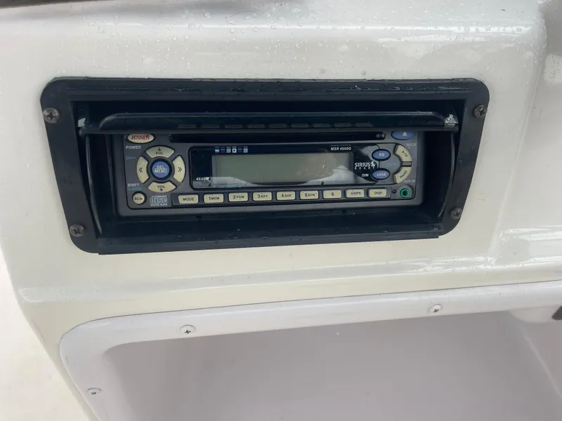 Slide: The Image of 2006 Hurricane FunDeck GS 202 OB boat stereo system, featuring a Jensen audio unit. - 19