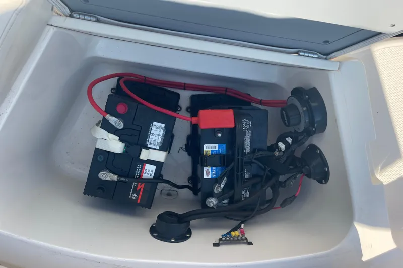 Slide: The Image of 2006 Hurricane FunDeck GS 202 OB boat battery compartment with wiring and connections. - 22