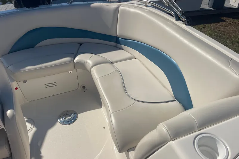 Slide: The Image of 2006 Hurricane FunDeck GS 202 OB boat interior with white and blue seating. - 24