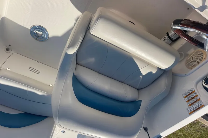 Slide: The Image of 2006 Hurricane FunDeck GS 202 OB boat interior with white and blue seating. - 26