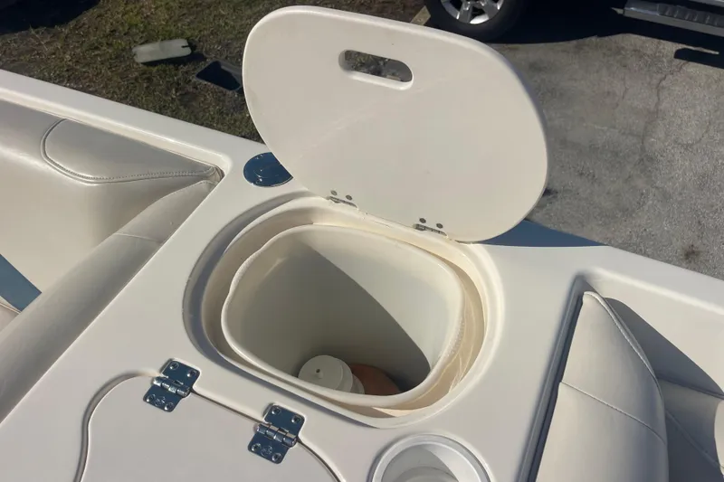 Slide: The Image of Open storage compartment on 2006 Hurricane FunDeck GS 202 OB boat. - 28