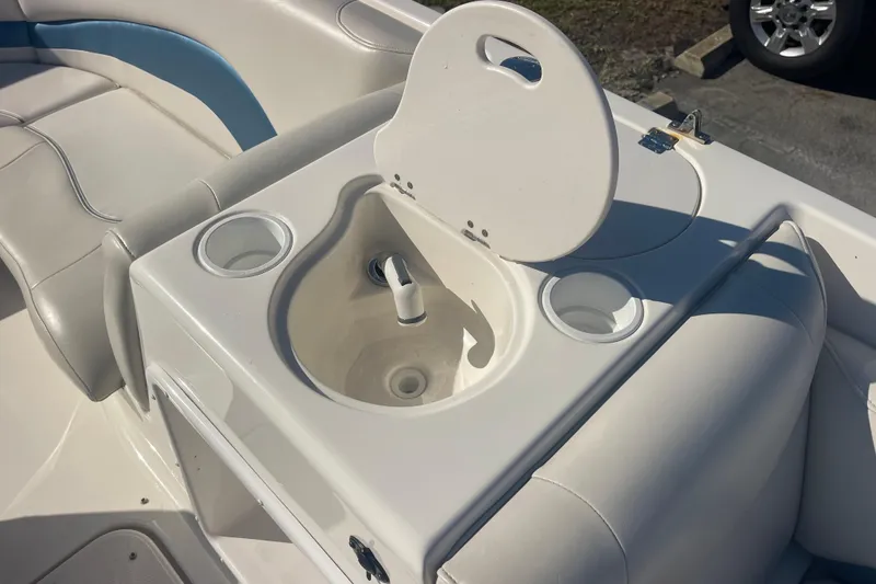 Slide: The Image of 2006 Hurricane FunDeck GS 202 OB boat interior with sink and seating area. - 29