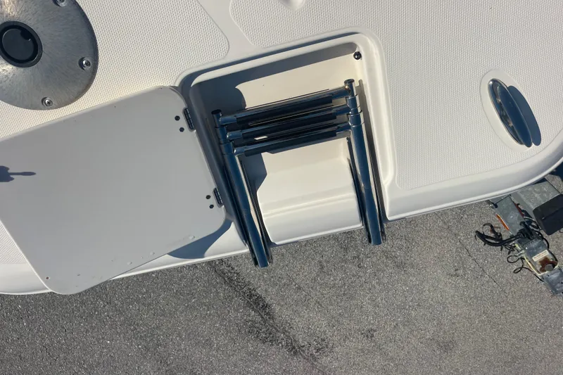 Slide: The Image of 2006 Hurricane FunDeck GS 202 OB boat with foldable ladder on deck. - 31