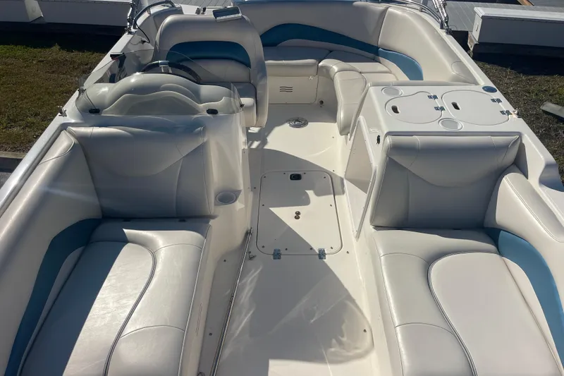 Slide: The Image of 2006 Hurricane FunDeck GS 202 OB boat interior with white and blue seating. - 32