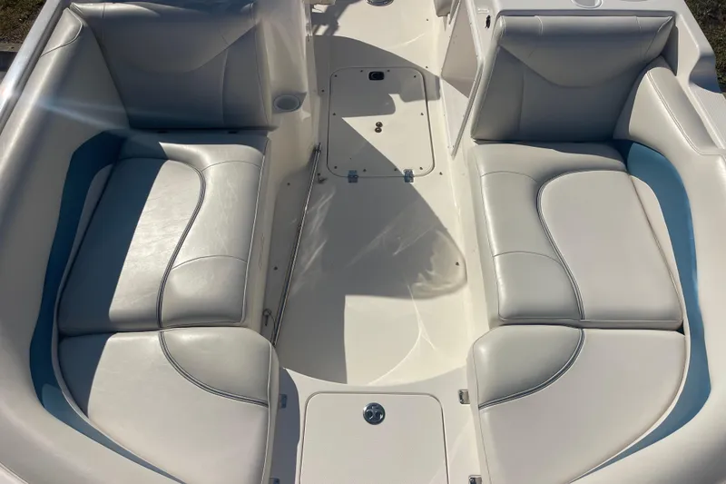 Slide: The Image of 2006 Hurricane FunDeck GS 202 OB boat interior with white cushioned seating. - 33