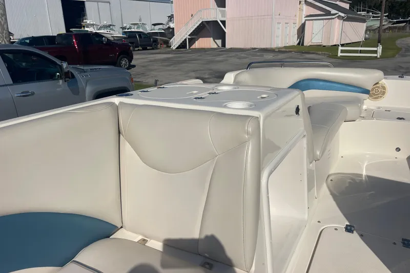 Slide: The Image of 2006 Hurricane FunDeck GS 202 OB interior with white seating and storage compartments. - 35