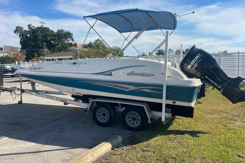 Slide: The Image of 2006 Hurricane FunDeck GS 202 OB boat on trailer with Suzuki outboard motor. - 5