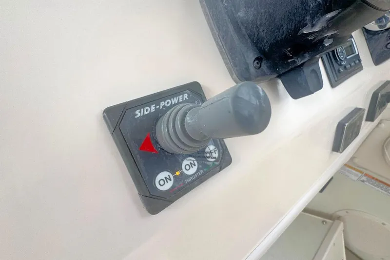 Slide: The Image of Side-Power thruster control on 2012 Grady-White Marlin 300 boat dashboard. - 10