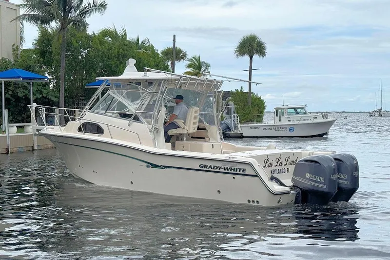 Slide: The Image of 2012 Grady-White Marlin 300 boat on water, Key Largo, with twin Yamaha engines. - 3