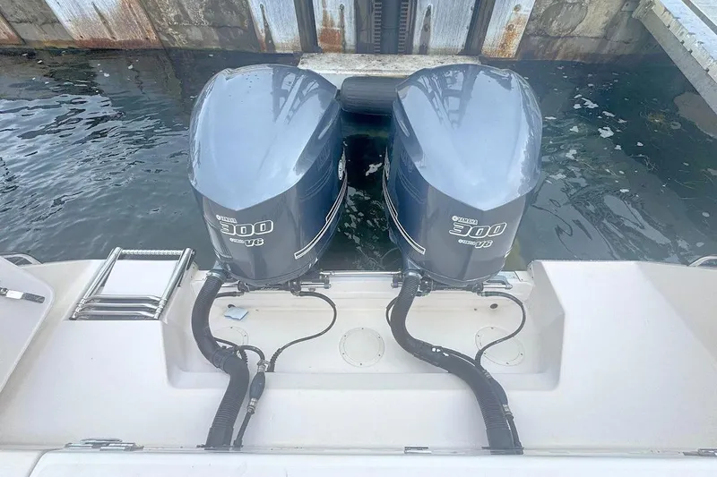 Slide: The Image of 2012 Grady-White Marlin 300 with twin Yamaha 300 outboard engines at dock. - 7