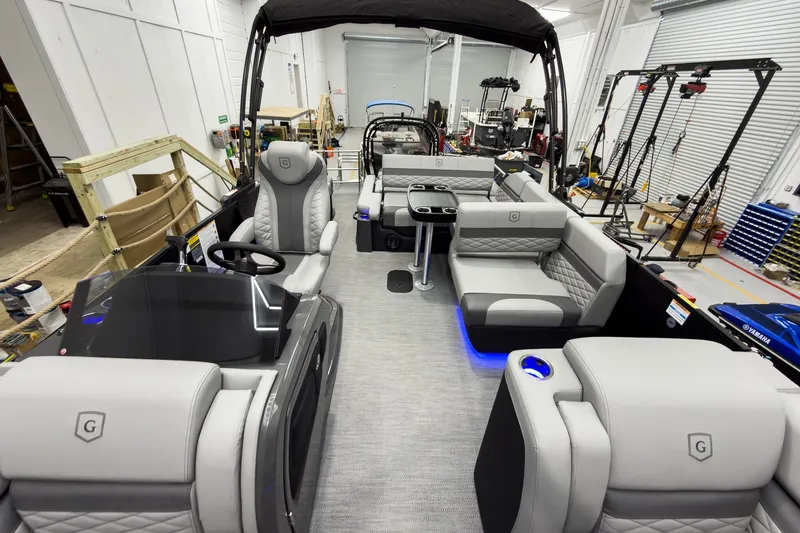 Slide: The Image of 2026 Godfrey Monaco 23' Tritoon interior with luxurious seating and modern design. - 20