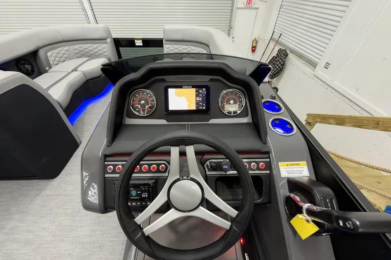 Slide: The Image of Interior view of 2026 Godfrey Monaco 23' Tritoon dashboard with modern controls and seating. - 27