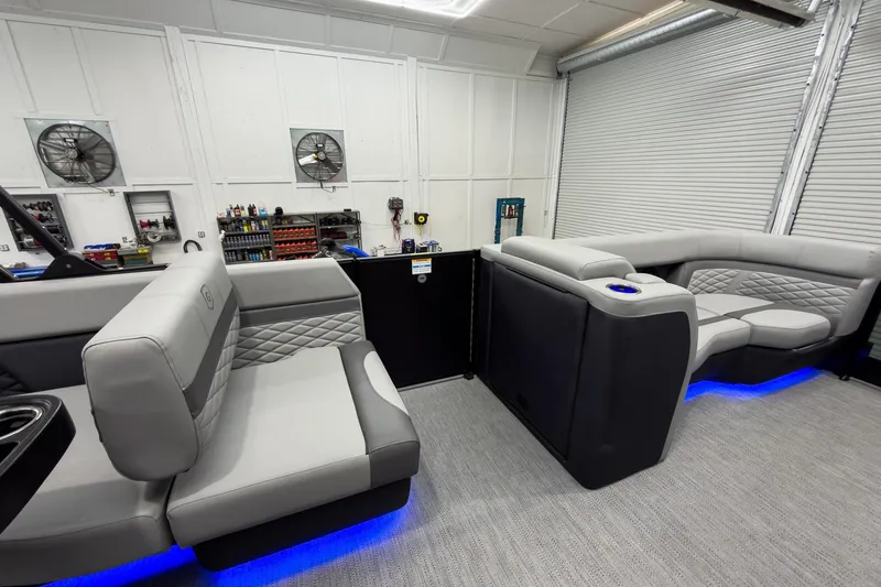 Slide: The Image of Luxurious interior of 2026 Godfrey Monaco 23' Tritoon with modern seating and ambient lighting. - 28