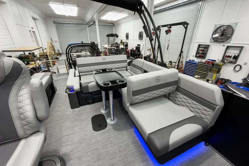 Slide: The Image of Luxurious interior of 2026 Godfrey Monaco 23' Tritoon with plush seating and modern design. - 30