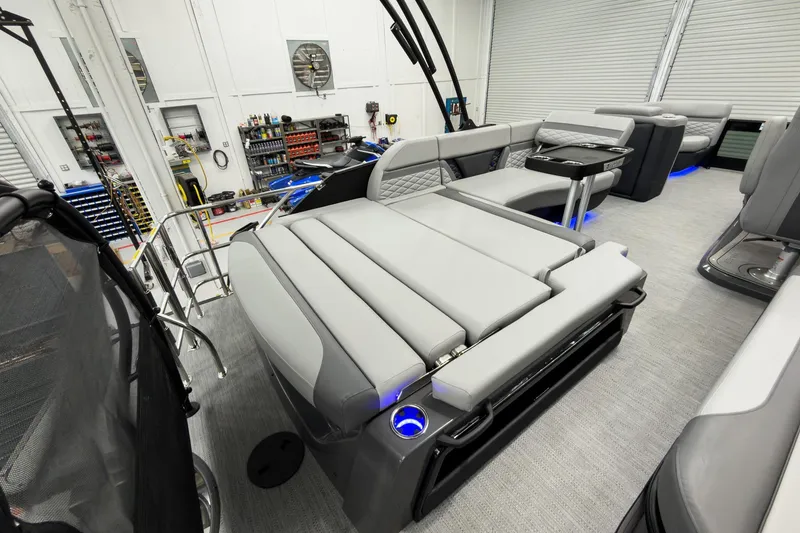 Slide: The Image of Luxurious interior of 2026 Godfrey Monaco 23' Tritoon with flip lounge seating. - 38